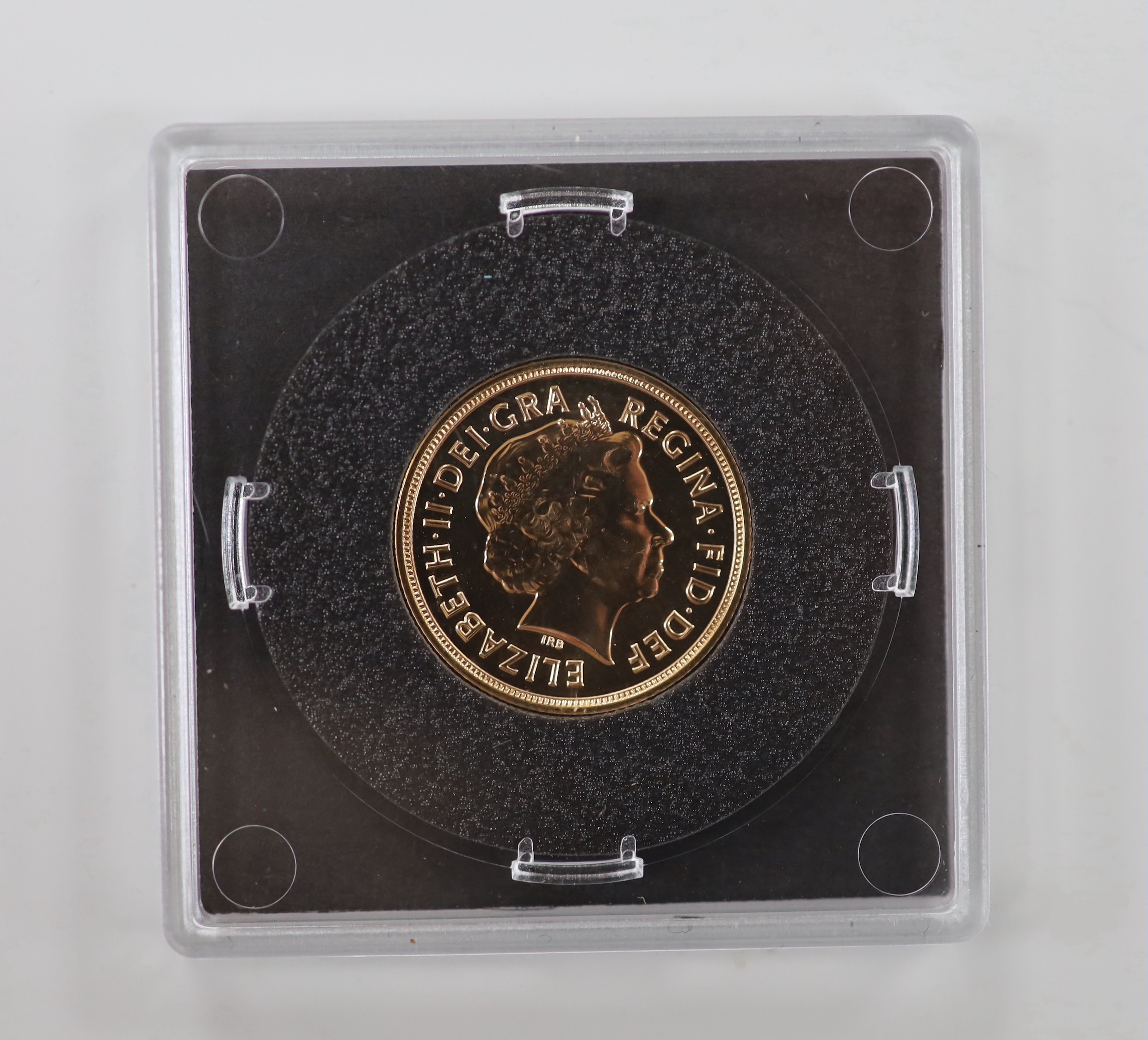 An Elizabeth II cased 2015 gold sovereign.